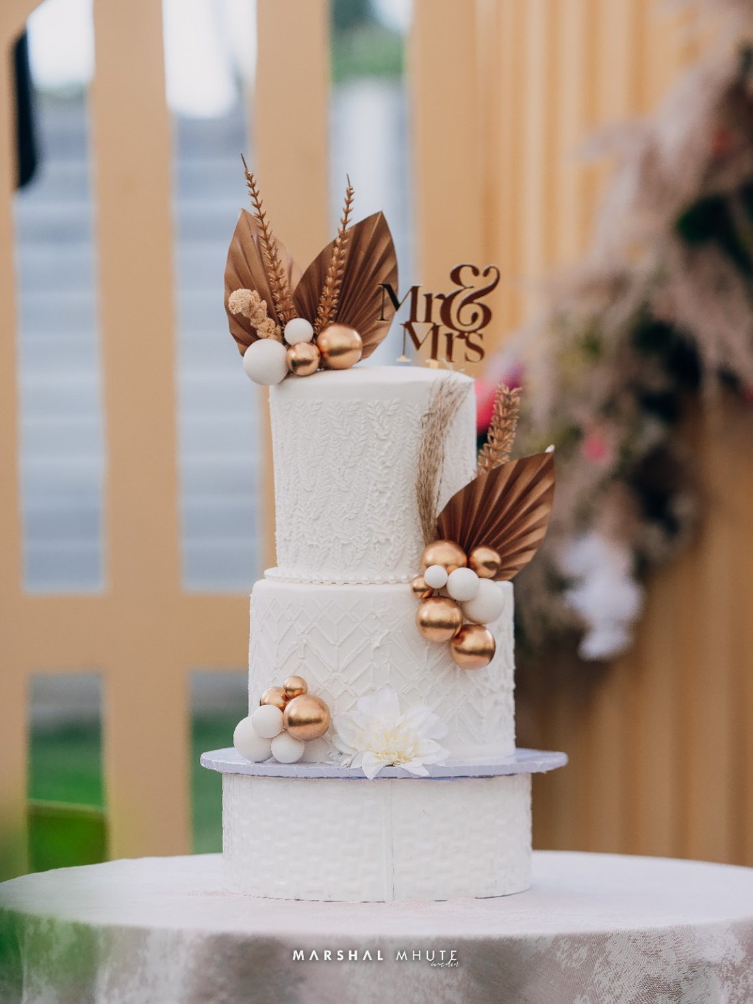 White and gold celebration cake detail