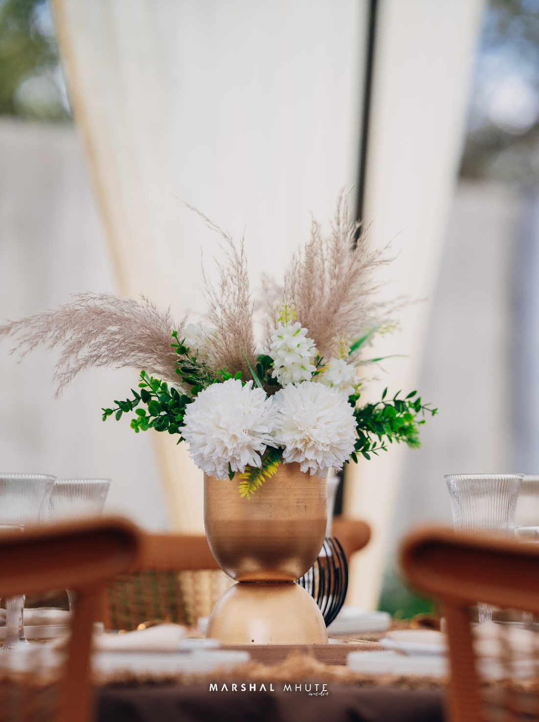 Soft floral and glassware table detail